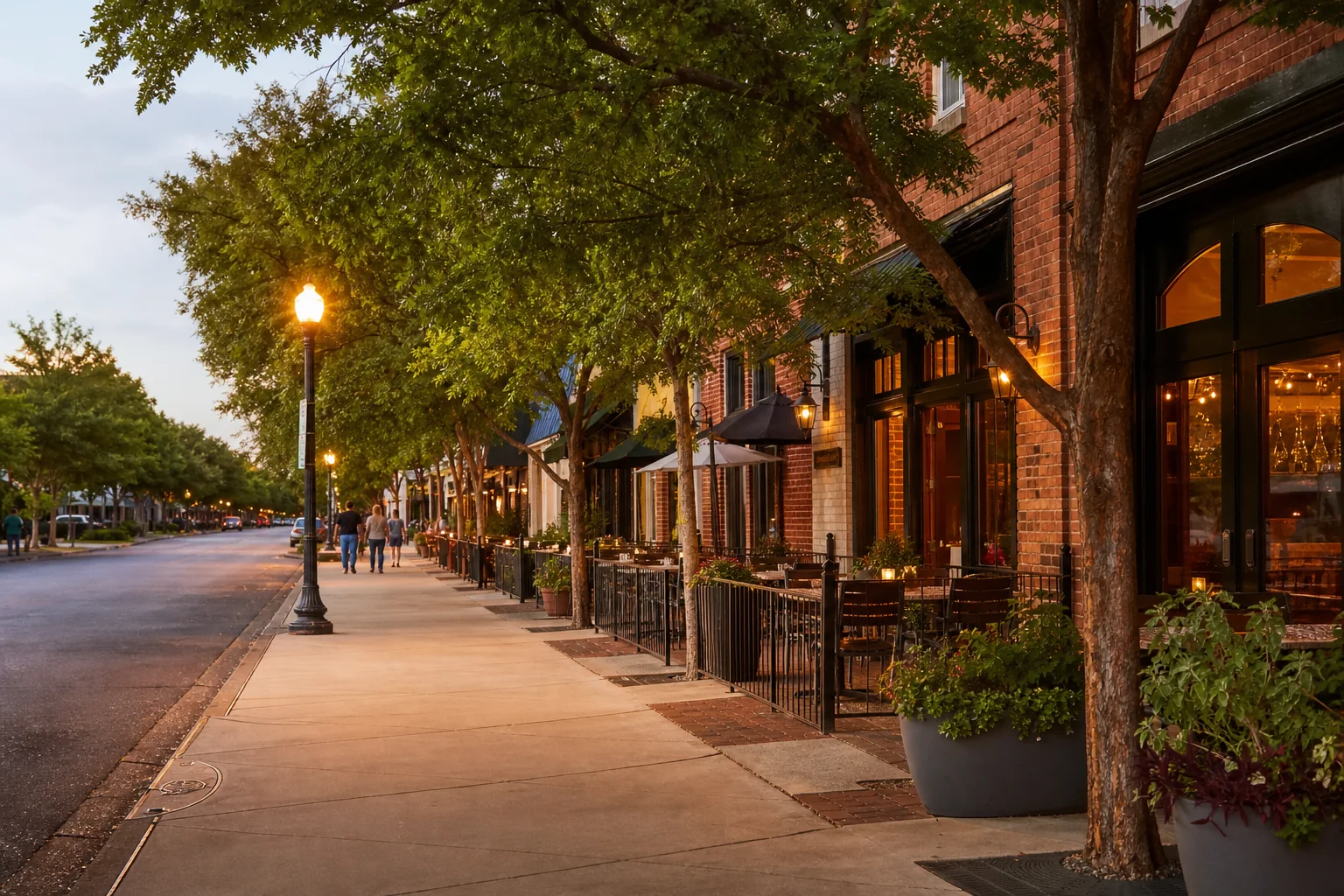 A warm, walkable Charlotte neighborhood street with cafes and mature trees
